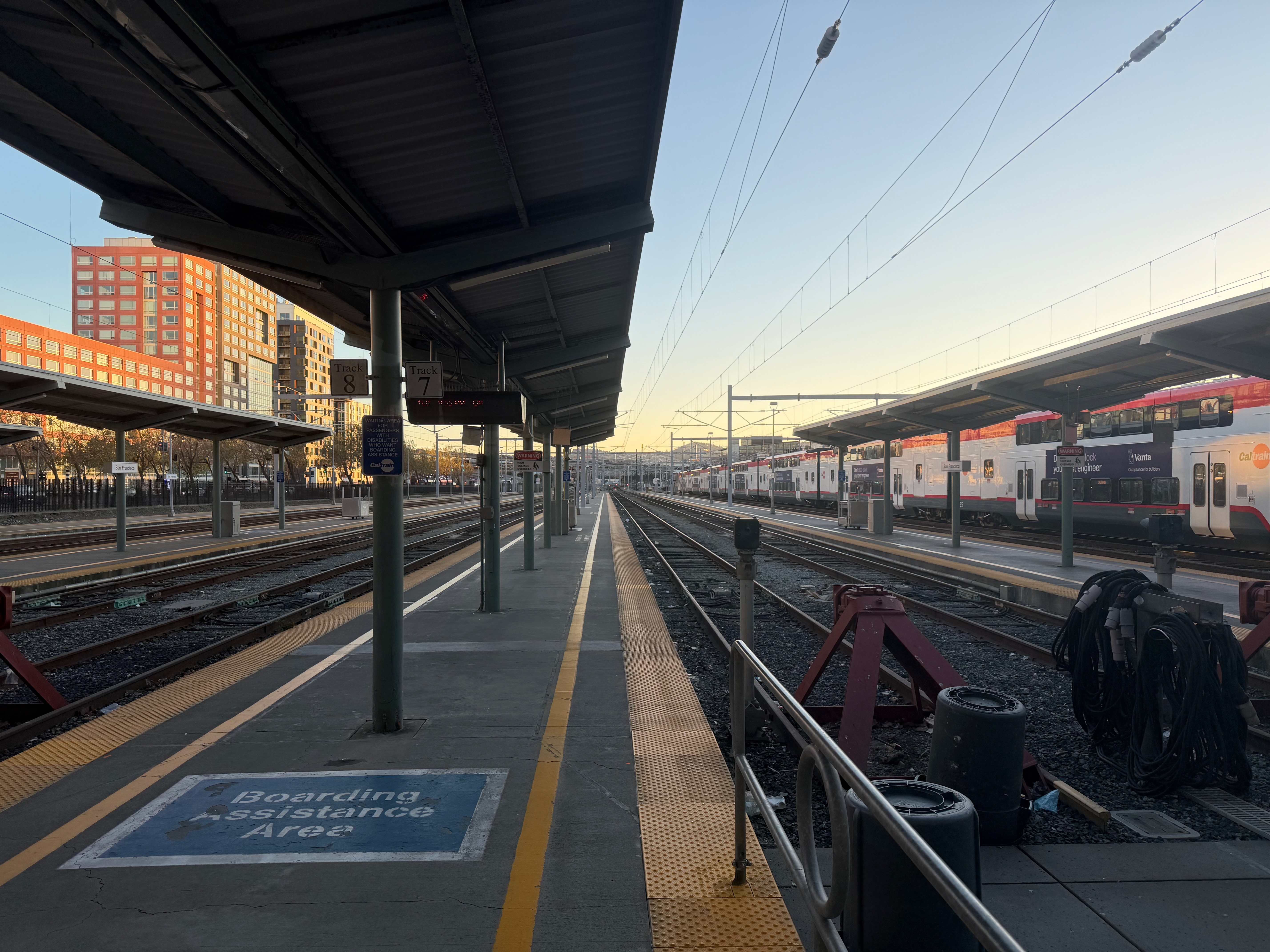 A view facing out toward the platforms at San Francisco Station. Each platform is completely flat, with no mini highs. A portable lift is on each platform.